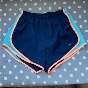 navy blue nike dri-fit shorts peachy/blue sides